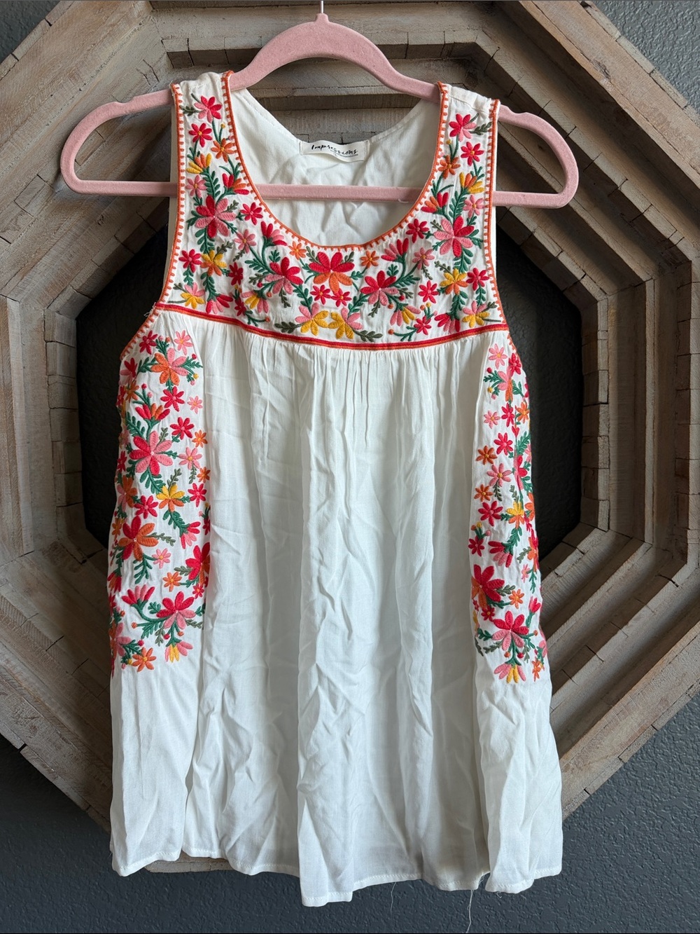 Breezy white embroidered sleeveless top